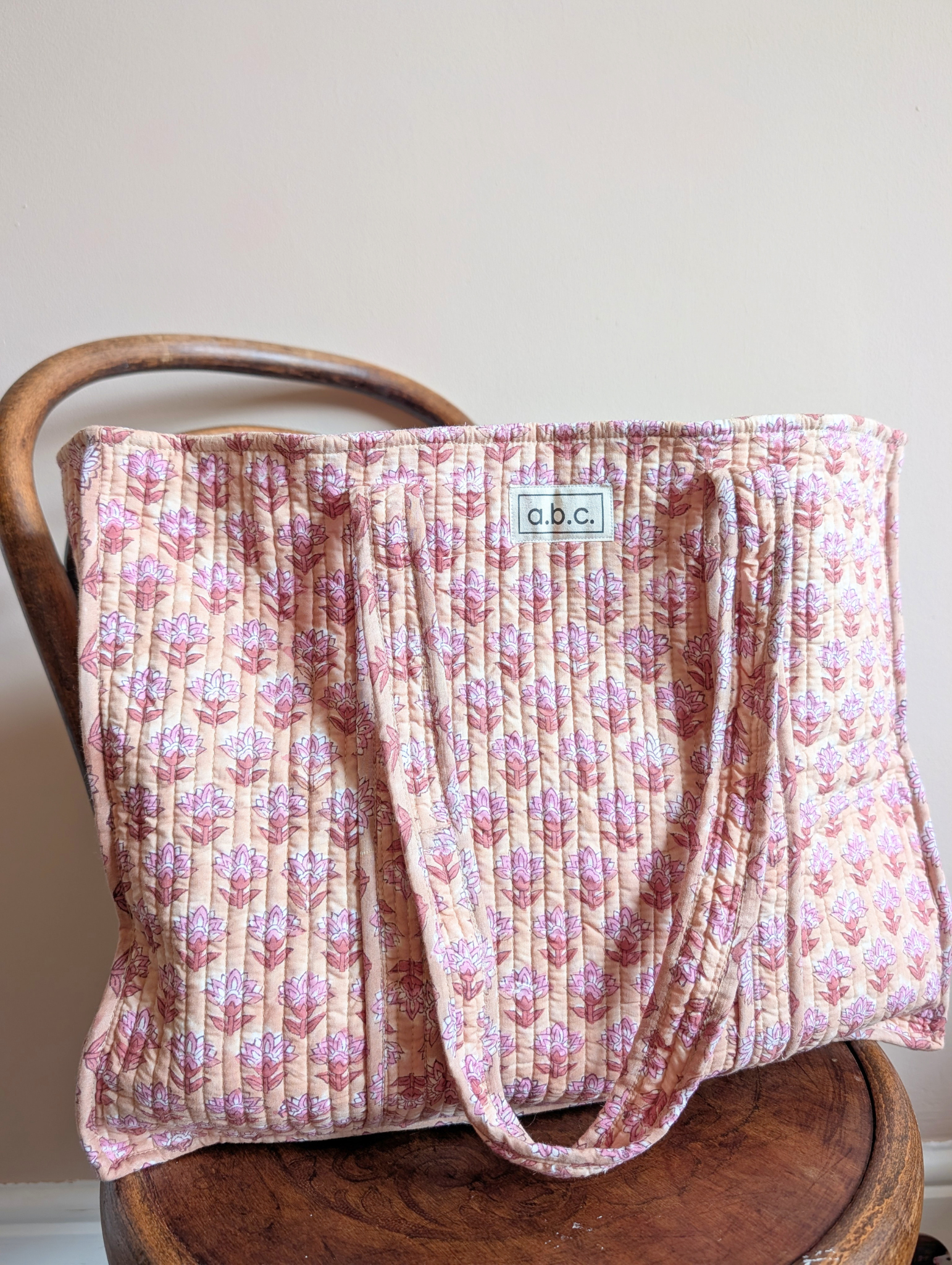 beige and pink floral tote bag