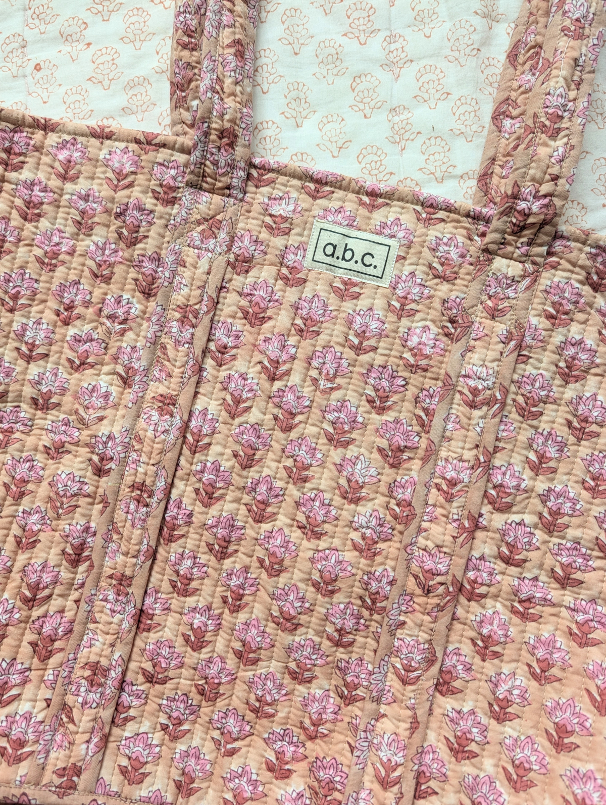 beige and pink floral tote bag